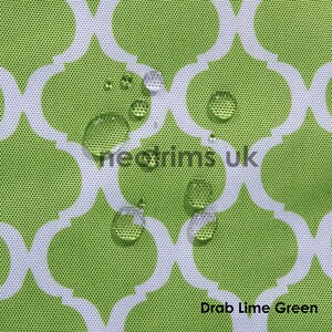 May include: Close-up of a lime green fabric with a white quatrefoil pattern. Water droplets are visible on the surface, indicating a waterproof material. The text "vieotrims uk" and "Drab Lime Green" are also visible.