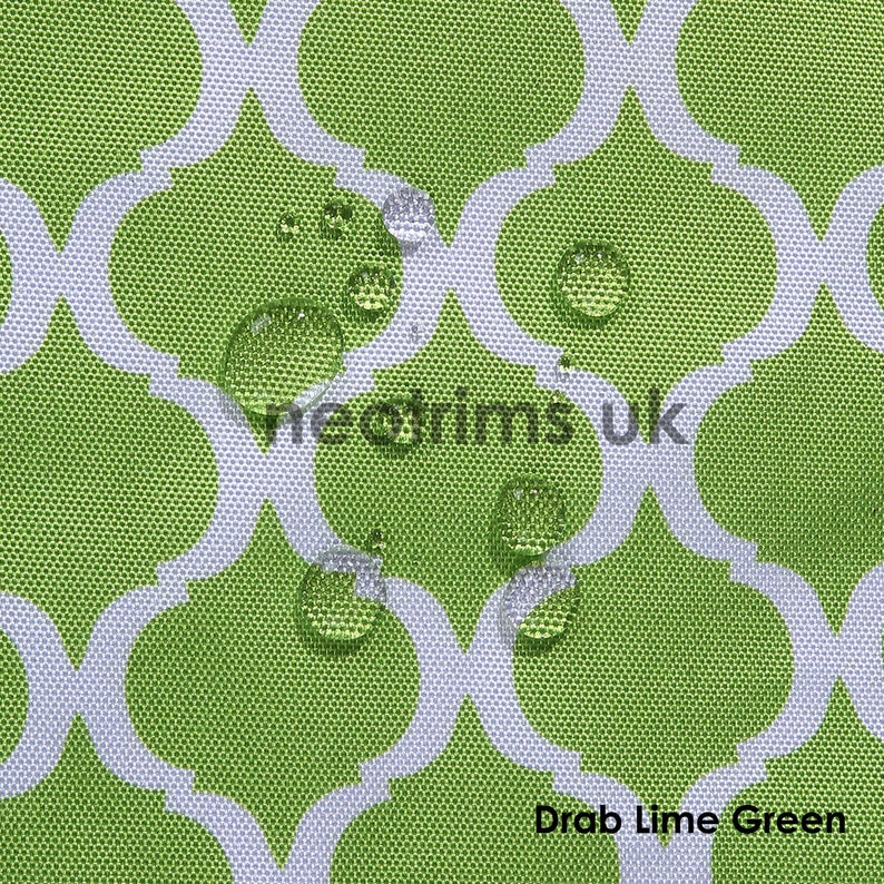 May include: Close-up of a lime green fabric with a white quatrefoil pattern. Water droplets are visible on the surface, indicating a waterproof material. The text "vieotrims uk" and "Drab Lime Green" are also visible.