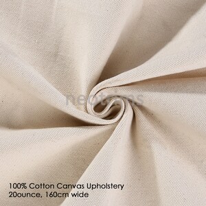 May include: Close-up of a natural-colored cotton canvas fabric. The fabric is woven with a tight weave and has a smooth, even texture. 100% Cotton Canvas Upholstery 20 ounce, 160cm wide