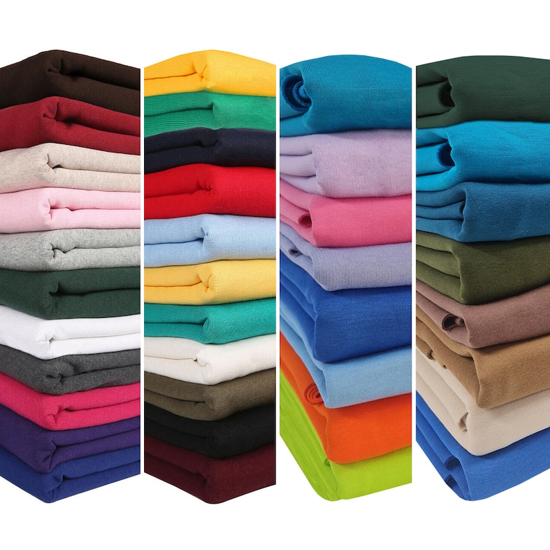 May include: A collection of fabric swatches in various colors, including red, blue, green, yellow, and brown. The fabric is folded and stacked in rows, creating a visual display of different textures and shades.