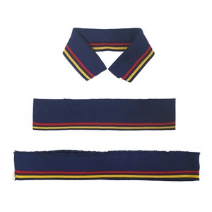 May include: Three pieces of navy blue knit fabric with red and yellow stripes. The fabric is likely for use as trim on clothing.