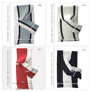 May include: Four different striped scarves with white and colored stripes. The scarves are folded and laid flat on a white background. The scarves are 13 cm wide and 6.5 cm wide. The scarves are 110 cm to 118 cm long.