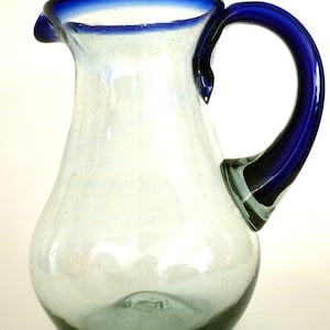 Hand blown glass pitcher with a blue rim pear shape 80 oz