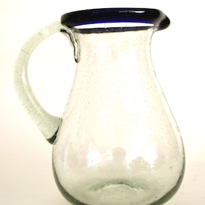 Hand blown small glass pitcher with a blue rim pear shape 32 oz