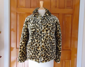 May include: A brown, black, and cream leopard print faux fur jacket with a zipper closure.