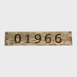 May include: A wooden sign with the number 01966 engraved in the wood.