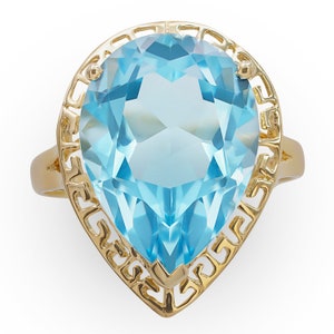 Anillo de topacio azul en forma de pera de oro amarillo de 14K