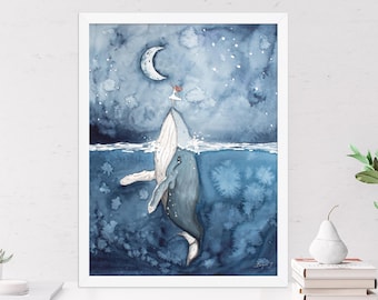 May include: A framed watercolor print featuring a blue whale breaching the surface of a dark blue ocean at night. A small figure stands on the whale's head, reaching toward a crescent moon in a starry sky. The artwork uses shades of blue and white.