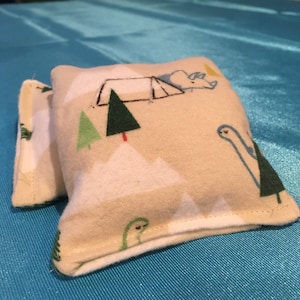 Calientamanos Dino Camp (Beige)