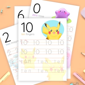 May include: Four printable worksheets featuring numbers 0, 2, 6, and 10. Each worksheet has a cartoon character and dotted lines for tracing the number. The worksheets include the words "zero nose", "two magnets", "ten fingers", and "ten".