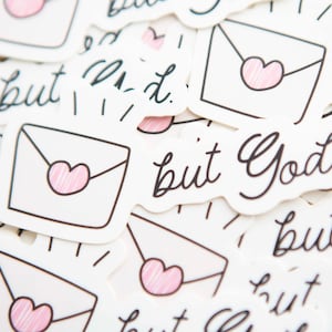 May include: A collection of stickers with the text "but God" and a simple illustration of a white envelope with a pink heart.