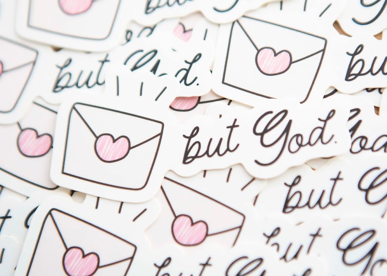 May include: A collection of stickers with the text "but God" and a simple illustration of a white envelope with a pink heart.
