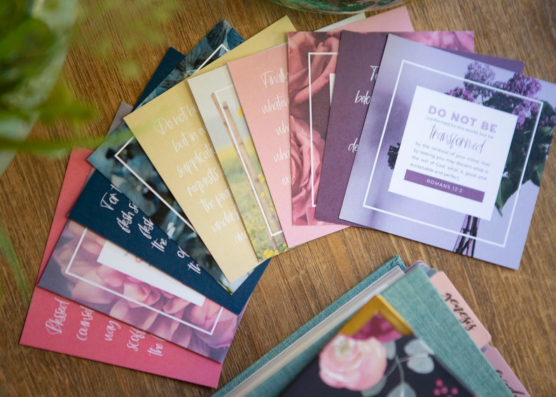May include: A set of colorful cards with floral designs and inspirational quotes. The cards feature a variety of flowers, including roses, lilacs, and daisies. The quotes are all about faith, hope, and love. The cards are perfect for adding a touch of inspiration to your home or office.