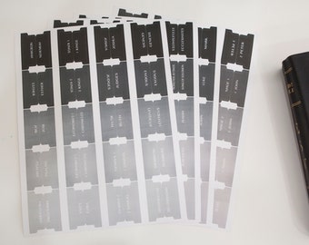 May include: A set of black and white Bible book tabs with a gradient design. The tabs are labeled with the names of the books of the Bible, including Genesis, Exodus, Leviticus, Numbers, Deuteronomy, Joshua, Judges, Ruth, 1 Samuel, 2 Samuel, 1 Kings, 2 Kings, 1 Chronicles, 2 Chronicles, Ezra, Nehemiah, Esther, Job, Psalms, Proverbs, Ecclesiastes, Song of Solomon, Isaiah, Jeremiah, Lamentations, Ezekiel, Daniel, Hosea, Joel, Amos, Obadiah, Jonah, Micah, Nahum, Habakkuk, Zephaniah, Haggai, Zechariah, Malachi, Matthew, Mark, Luke, John, Acts, Romans, 1 Corinthians, 2 Corinthians, Galatians, Ephesians, Philippians, Colossians, 1 Thessalonians, 2 Thessalonians, 1 Timothy, 2 Timothy, Titus, Philemon, Hebrews, James, 1 Peter, 2 Peter, 1 John, 2 John, 3 John, Jude, and Revelation.