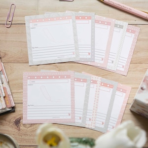 May include: A set of 10 blank recipe cards with a pink and gray design. The cards have a space for the recipe name, ingredients, and instructions. The cards are perfect for organizing your favorite recipes.