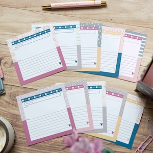 May include: A set of 10 printable recipe cards with different patterned designs. Each card has a space for the recipe name, ingredients, and instructions. The cards are in shades of pink, gray, blue, and yellow.