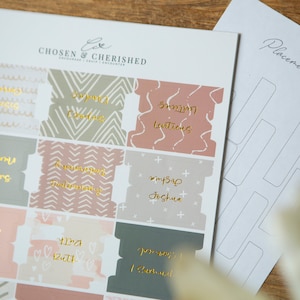 May include: A set of 9 printable divider labels with gold lettering and various patterns. The labels include "Wedding Numbers", "Wedding Readings", "My Sap Joshua", "Baby Judges", "The Ruth", "Guest Book", "Something Blue", "Something Old", and "Something New".