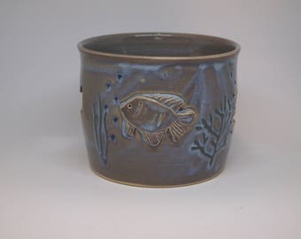 Pottery Candle Holder with Hand Carved Decorative Fish Cut Outs and Detailed Ornaments