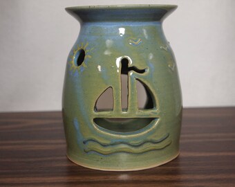 Ceramic Pottery Oil Warmer with Hand Carved Decorative Sailboat and Sun Cut Outs