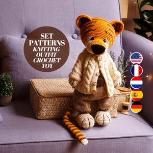 May include: A crocheted tiger toy wearing a knitted outfit. The toy is sitting on a purple sofa with a wooden box and a bouquet of lavender flowers. The image includes the text "SET PATTERNS KNITTING OUTFIT CROCHET TOY".