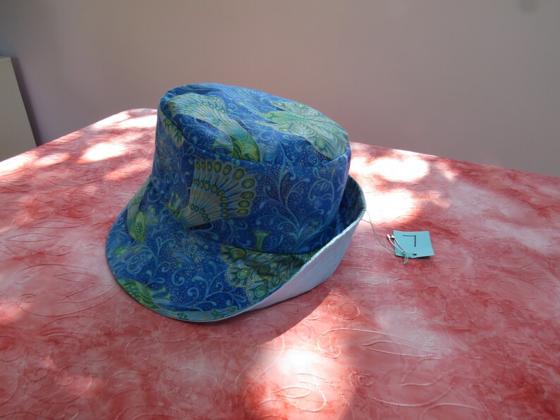 large blue peacock sun hat