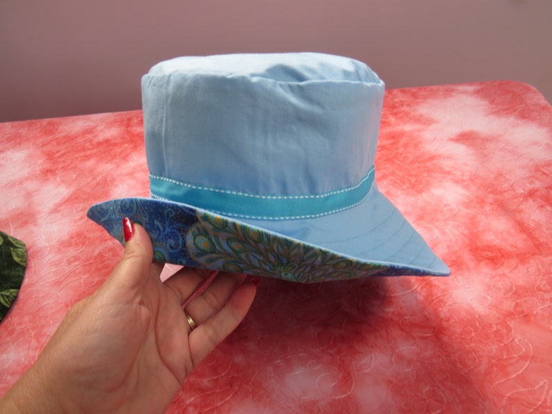 large blue peacock sun hat