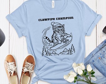 Camiseta divertida de gato haciendo snowboard - Regalo para amantes de los gatos, campeón de Clawpipe, deportes de invierno - Camiseta gráfica unisex de snowboard