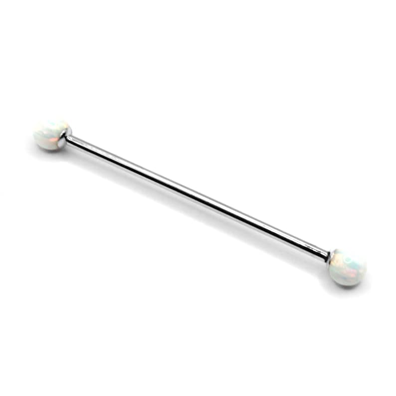 May include: A silver barbell with white opal ends. The barbell is approximately 3/8 inch in diameter.