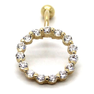 May include: Gold belly button ring with a circle of clear cubic zirconia stones.