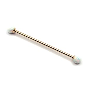 May include: Gold barbell with white opal ends.