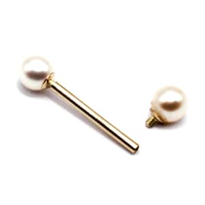 May include: A gold barbell with two white pearl ends. The barbell is separated into two pieces, one with a screw-on end.