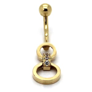 May include: Gold belly button ring with two interlocking circles and a row of clear stones.