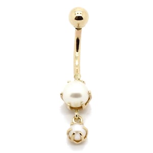 May include: Gold belly button ring with two white pearls. The top pearl is larger than the bottom pearl.