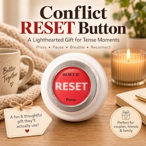 May include: A round white plastic button with a silver rim and a red center featuring the white text RESET, RESET it!, and Press. The button is displayed with text that reads Conflict RESET Button, A Lighthearted Gift for Tense Moments, Press, Pause, Breathe, Reconnect.