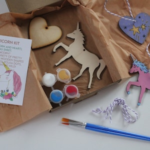 May include: A unicorn craft kit with wooden unicorn and heart shapes, paint, brushes, and twine. The kit includes instructions for decorating the shapes with paint.