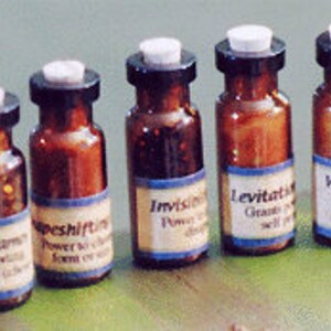 May include: Five small brown glass bottles with white tops and blue labels. The labels have text that reads "Game Over", "Shapeshift", "Invisible", "Levitate", and "Weather Control".