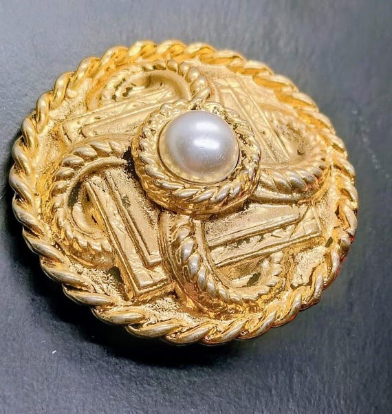 Revlon Charlie brooch vintage 80s round baroque gold brooch, Revlon design jewelry collection