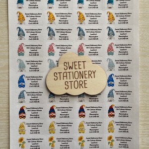 May include: A sheet of colorful stickers featuring a gnome design. The stickers have the text "Sweet Stationery Store" and the address "116 Colman Avenue, Lawford, Manningtree, Co11 2HB UK".