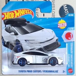 May include: A white ceramic mug with a black handle and the text "But First, Coffee" in a handwritten style. The mug is likely 11-15 ounces, perfect for a morning beverage.