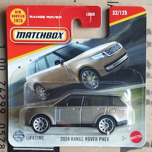 May include: A Matchbox toy car of a 2024 Range Rover PHEV in a gold color. The packaging is red and black with the text "NEW NOUVEAU 2025" and "MATCHBOX". The toy car is designed with metal parts and is suitable for children aged 3 and up.
