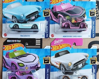 May include: Four Hot Wheels toy car packages, two featuring a 1956 Corvette and two featuring a Monster High Ghoul Mobile. The Corvette packages are blue and white with the Barbie logo. The Monster High Ghoul Mobile packages are black and pink with the Monster High logo. Each package features a 1/10 scale model of the car and the text "HW Screen Time".