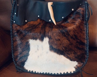 Cowhide and leather shoulder bag
