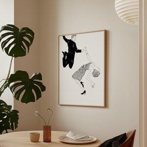 May include: Black and white line drawing of a couple dancing. The man is jumping in the air while holding the woman's hand. The woman is wearing a dress and is holding onto the man's hand with her other hand. The drawing is on a white background.
