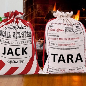 May include: Two white canvas Santa sacks with red trim. One sack says "North Pole Mail Service Special Delivery for JACK" and the other says "Santa Claus Delivery Method: Rudolph's Midnight Express Delivery: December 25th Please Deliver the Enclosed Present to: TARA Checked Twice Elf Approved By: Naughty or Nice? Nice & Sweet"