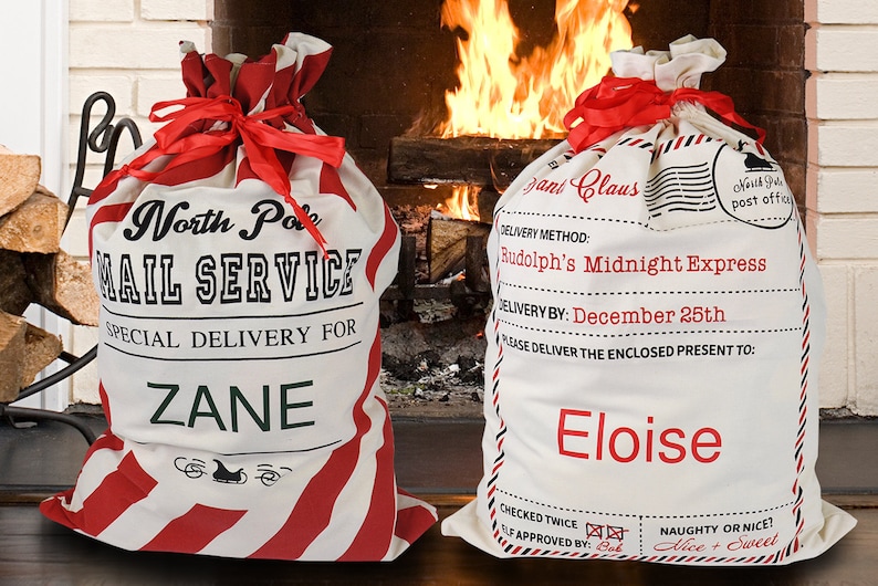 May include: Two red and white striped Christmas gift bags with personalized names. The bag on the left says "North Pole Mail Service Special Delivery for Zane". The bag on the right says "Santa Claus Delivery Method: Rudolph's Midnight Express Delivery By: December 25th Please Deliver the Enclosed Present to: Eloise Checked Twice Elf Approved By: Bob Naughty or Nice? Nice + Sweet".