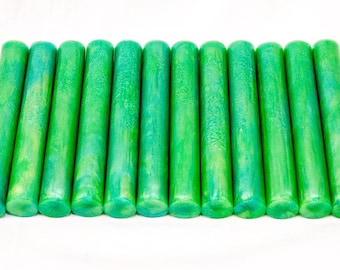 May include: A row of 15 green and blue wax sticks for sealing envelopes or invitations.