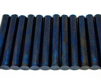 May include: A row of 15 dark blue acrylic rods with a glittery finish. The rods are approximately 1/2 inch in diameter and 12 inches long.