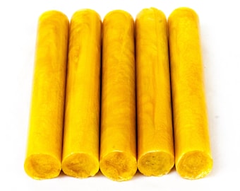 May include: Five yellow wax sticks for sealing envelopes or letters. The wax is translucent and has a slight shimmer.