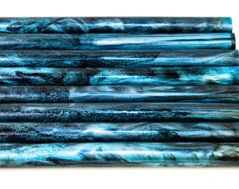 May include: Ten teal and black marbled acrylic pen blanks, stacked in a row.