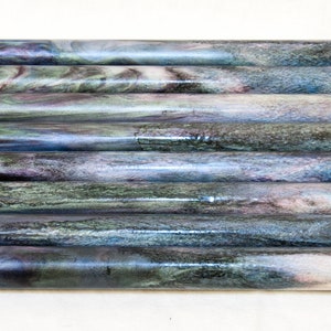 May include: Ten iridescent blue, green, and purple acrylic pen blanks. The blanks have a marbled pattern.